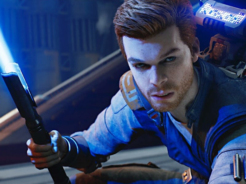 A young man with short brown hair holds a blue lightsaber in a dynamic pose. He wears a futuristic o...