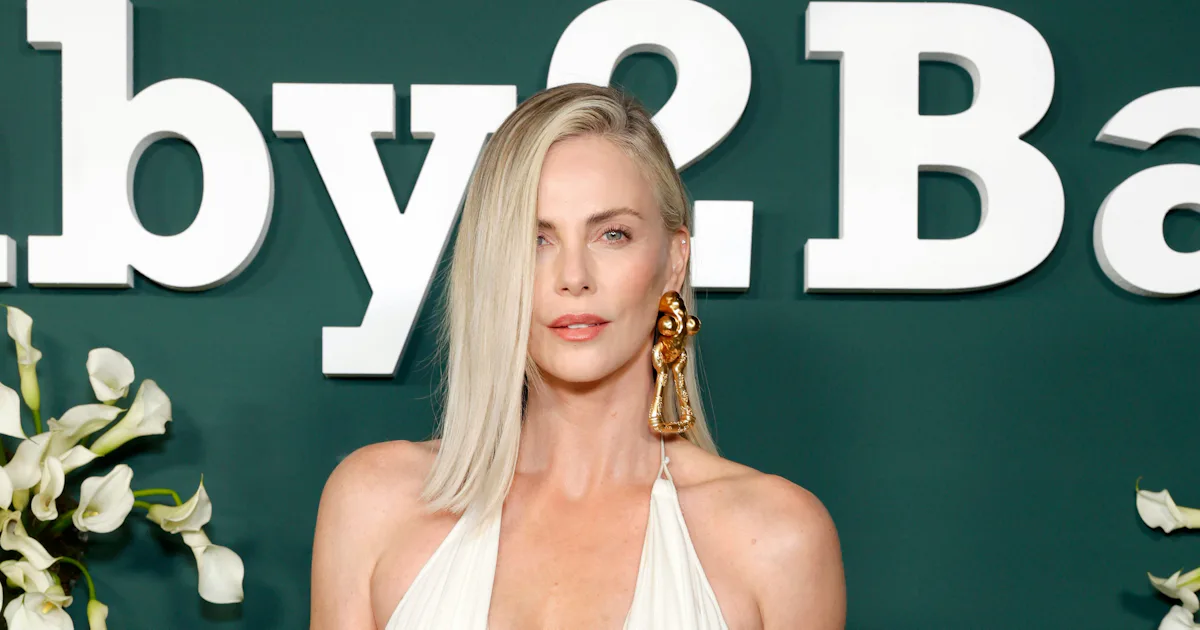 Charlize Theron Looks Goddess-Like In Plunging Corset Dress and Surreal ...