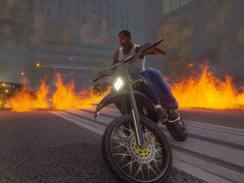 CJ Akira-slides through flames on a dirtbike