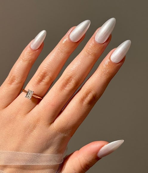 White chrome nails are trending for winter 2025.