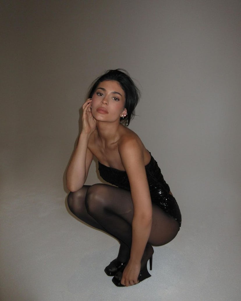 Kylie Jenner wears a sequined tube top and sequined undies.