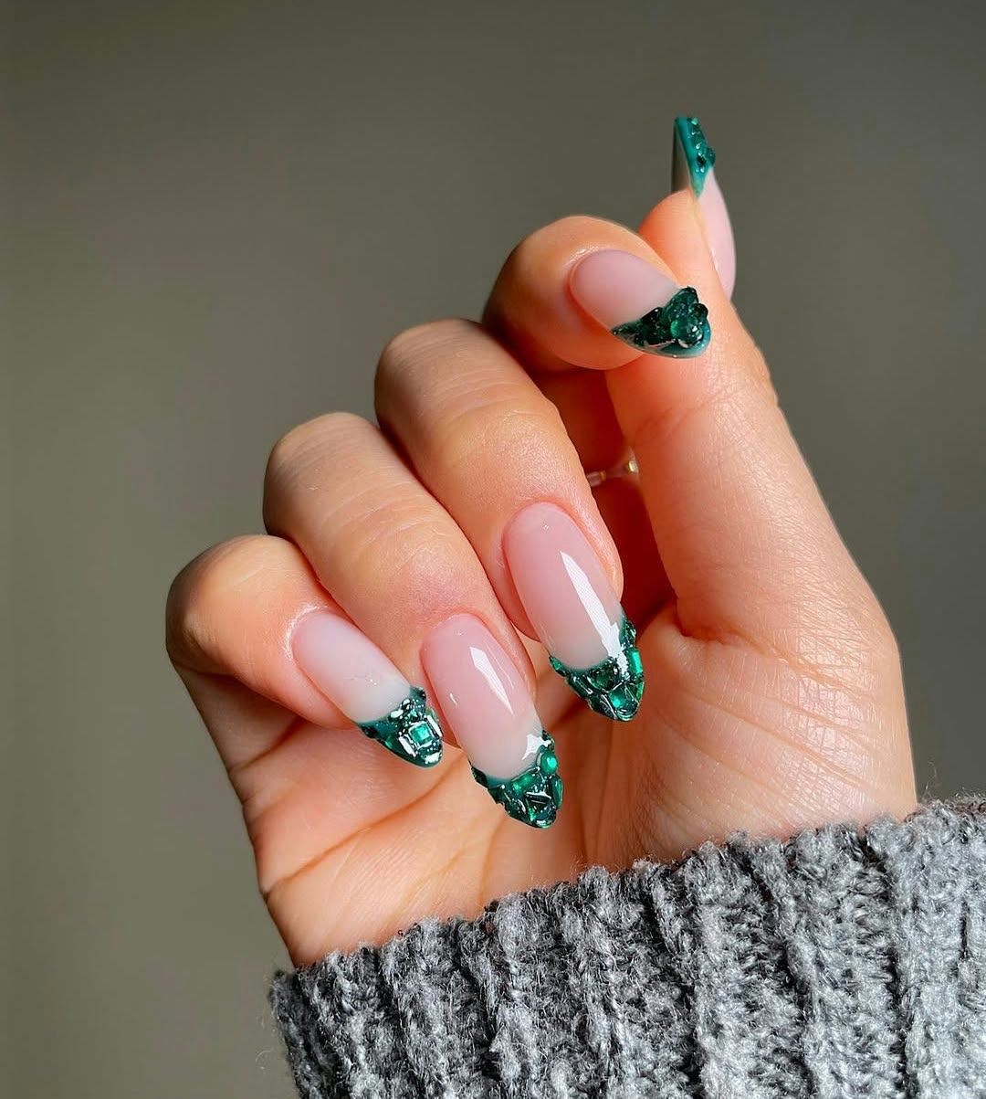 Here are 12 emerald green nail art designs to get in on winter 2025's biggest manicure trend.