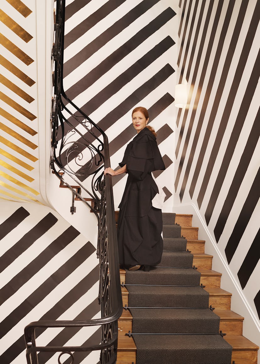 Manuela Wirth wears a Yohji Yamamoto dress; Maison Margiela shoes; her own jewelry. The artwork in t...