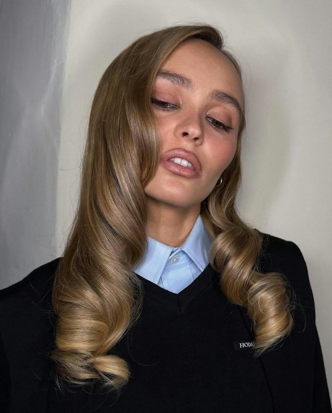 Lily-Rose Depp wore retro old Hollywood curls and contoured lips.