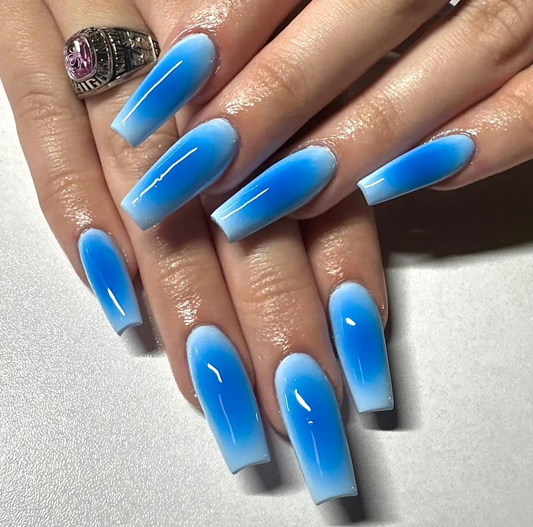 Try blue aura nail art for Sagittarius season 2024.