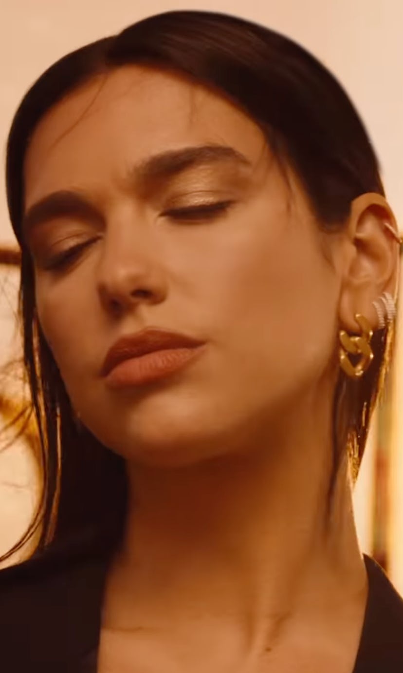 Dua Lipa forgot to wear a bra for her latest YSL campaign.