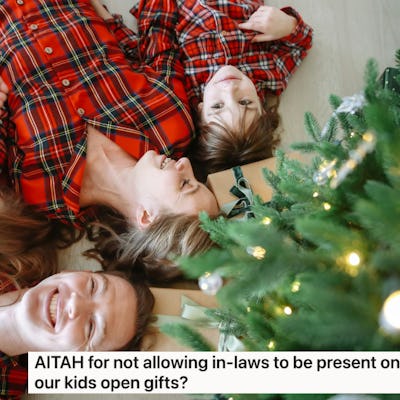 A family in matching red plaid pajamas lies on the floor, smiling, surrounded by Christmas decorations and a tree.