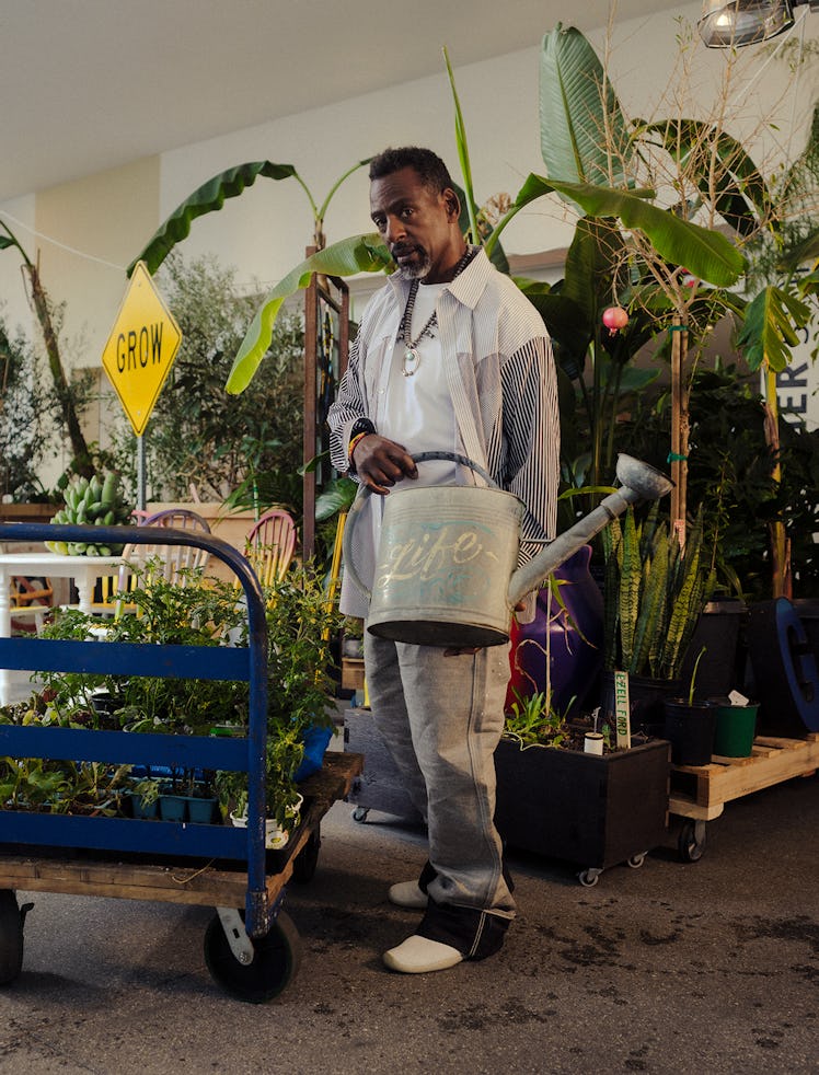 Ron Finley with his installation Grounded, 2024, at the Hammer Museum, in Los Angeles. Finley wears ...