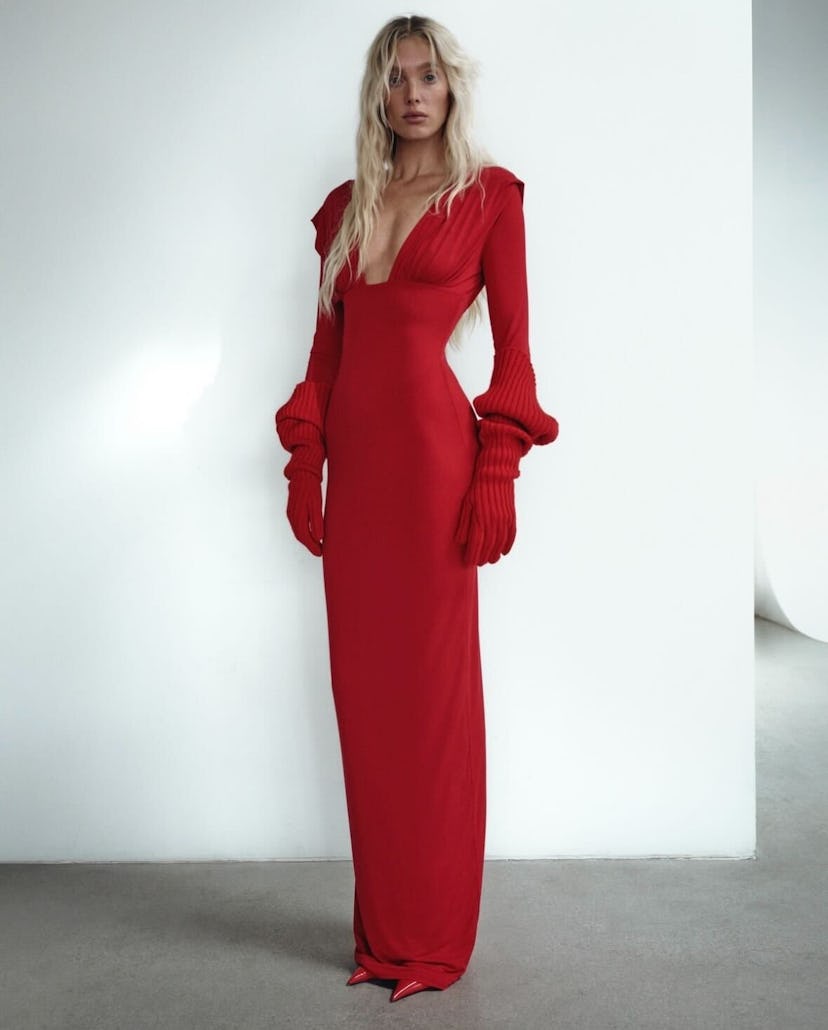 Elsa Hosk’s plunging dresses included belly button Cutouts, sheer fabric, and padded shoulders