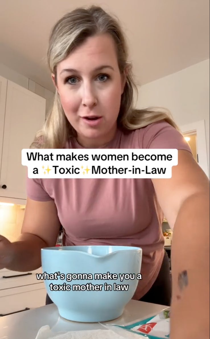 A woman in a kitchen is speaking to the camera, holding a bowl. Text overlays read "What makes women become a ✨Toxic✨ Mother-in-Law."