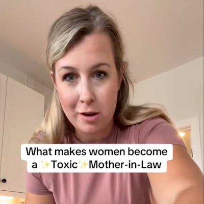 A woman in a kitchen is speaking to the camera, holding a bowl. Text overlays read "What makes women become a ✨Toxic✨ Mother-in-Law."