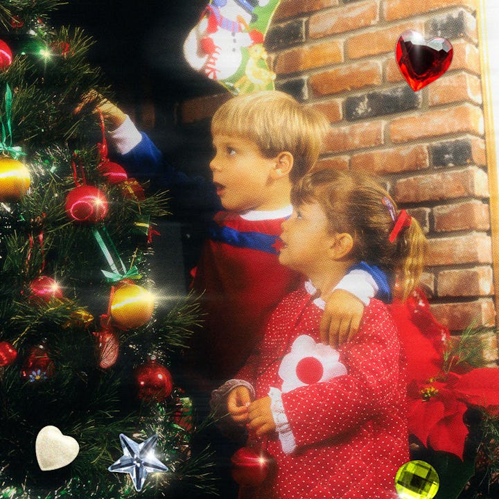 Two children decorate a Christmas tree with colorful ornaments. The background features a cozy brick...
