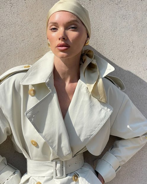 Elsa Hosk wears an ivory trench coat.