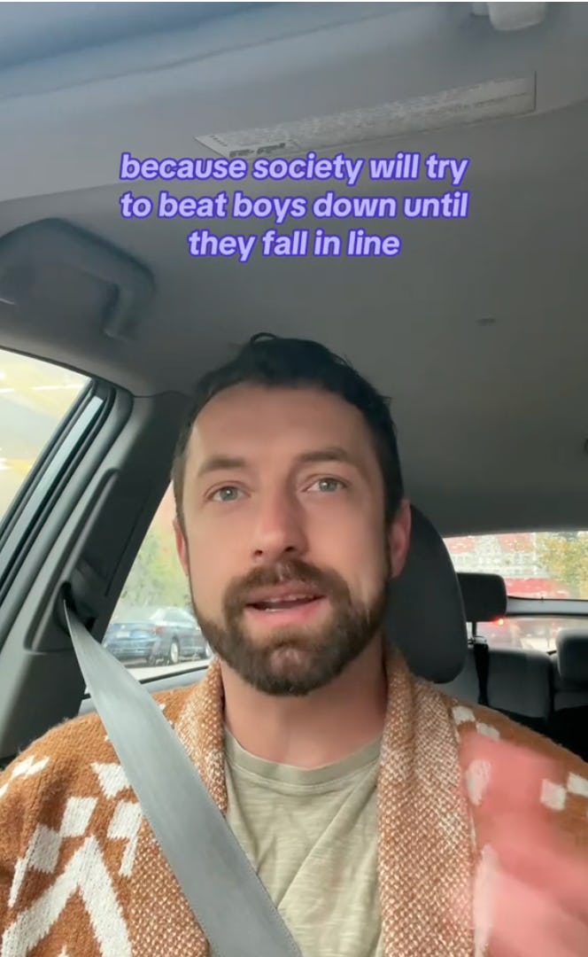 A man with a beard speaks in a car, gesturing while discussing societal pressures on boys, with text above him summarizing his point.