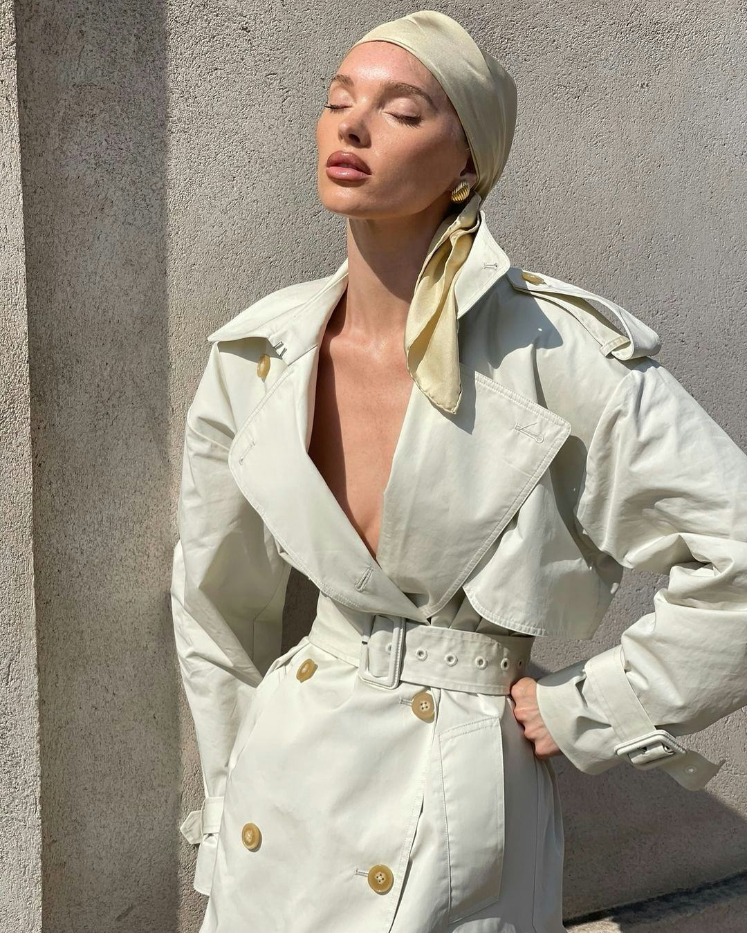 Elsa Hosk wears an ivory trench coat.