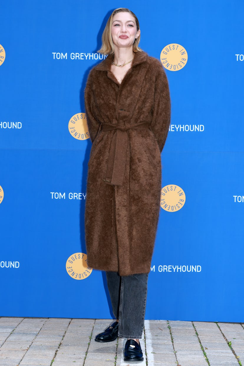 Gigi Hadid wore a bathrobe coat at her pop-up store launch.