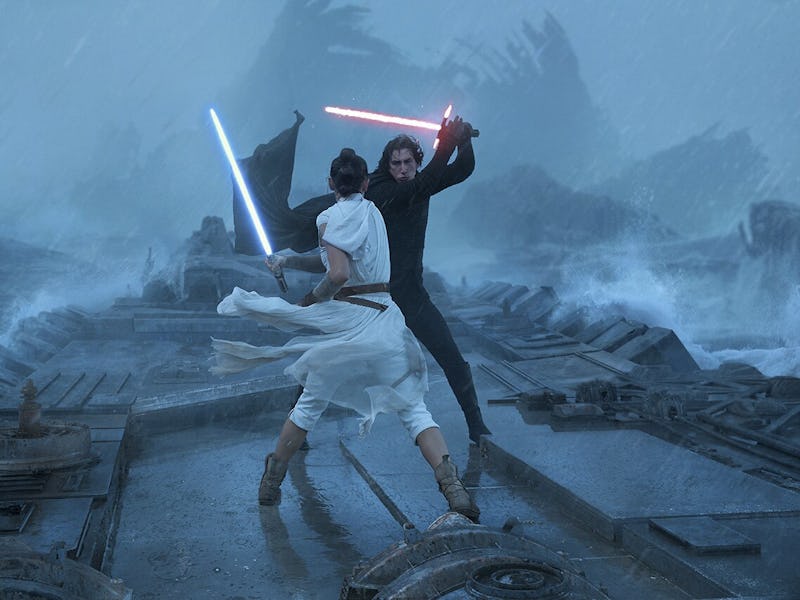 A fierce duel takes place between two figures wielding lightsabers on a stormy, debris-strewn landsc...