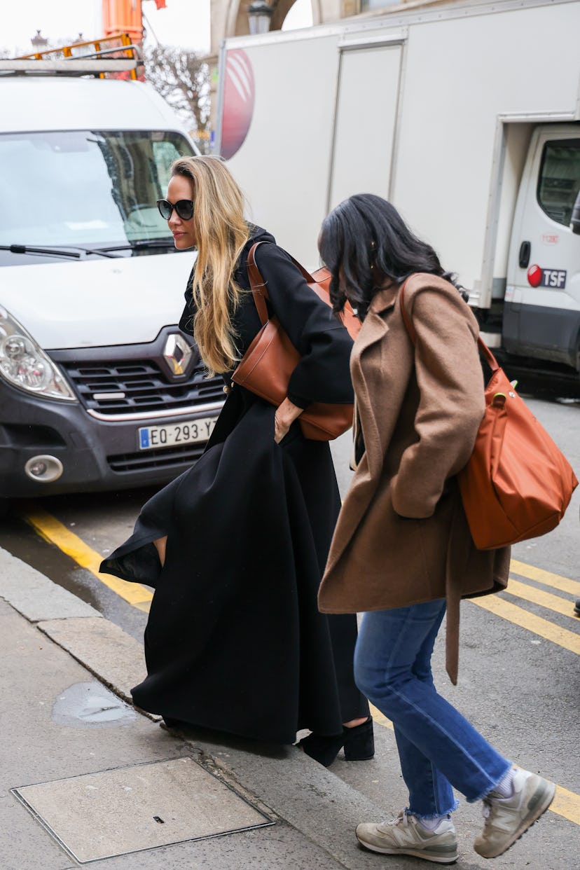 Angelina and her daughter Zahara walk on the sidewalk