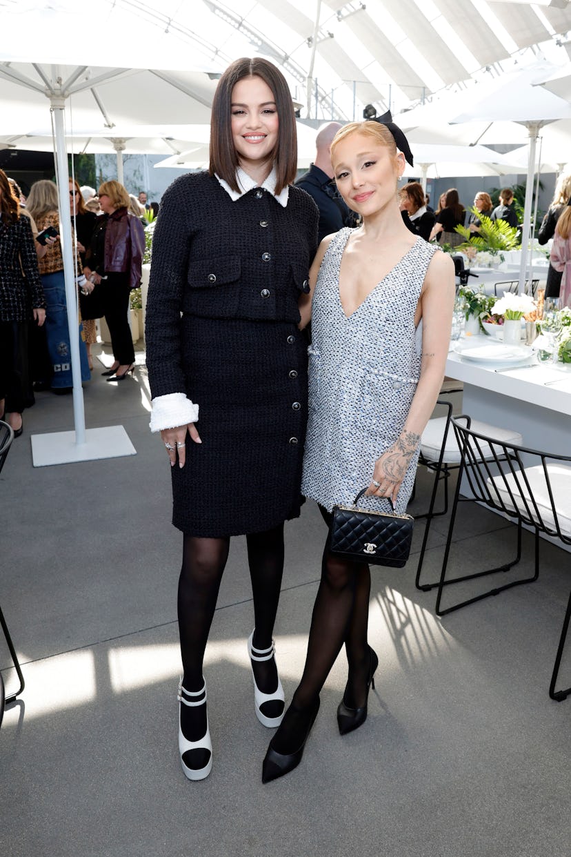 Selena Gomez, wearing CHANEL, and Ariana Grande, wearing CHANEL, attend the Academy Women's Luncheon...