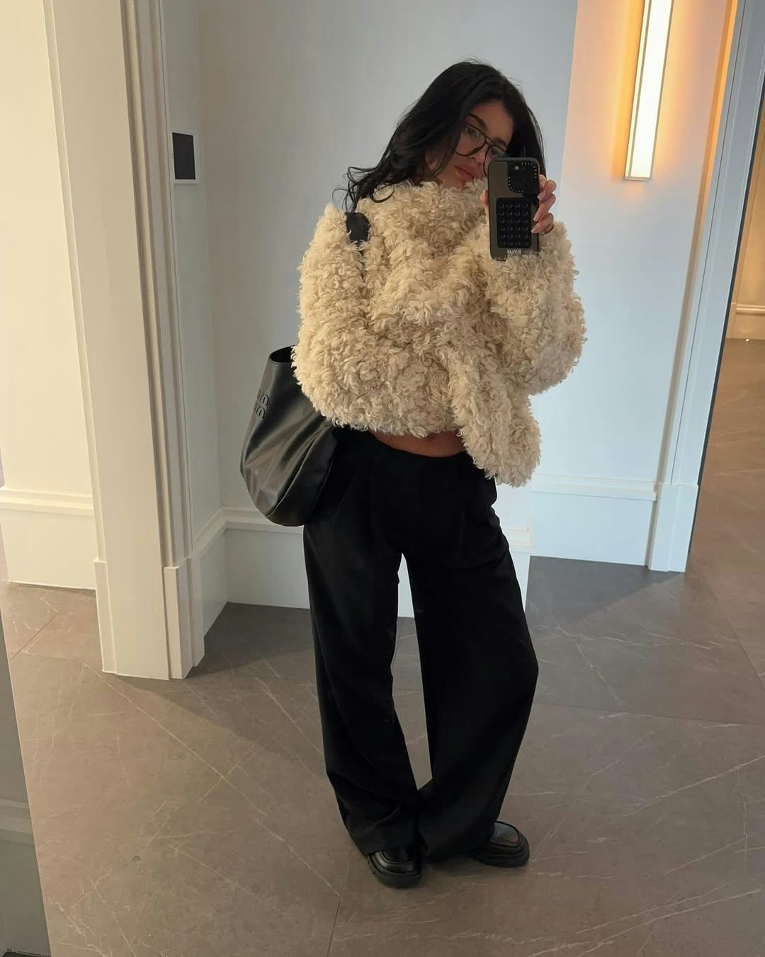 Kylie Jenner wears a shaggy pullover from Khy.