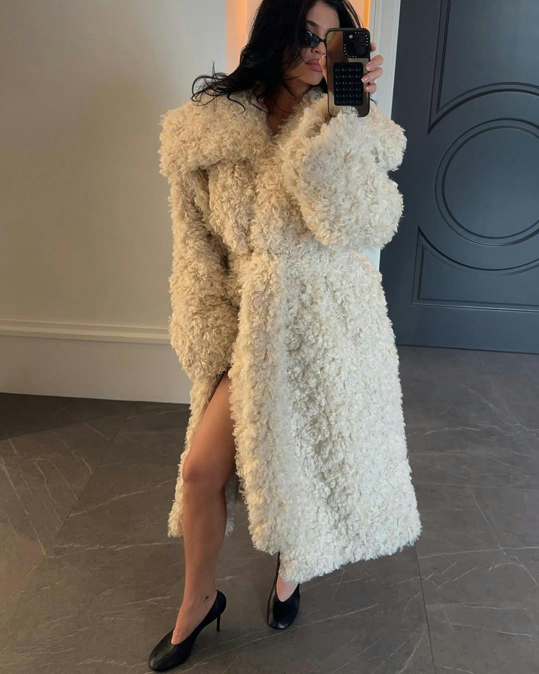 Kylie Jenner wears a shaggy coat from Khy.