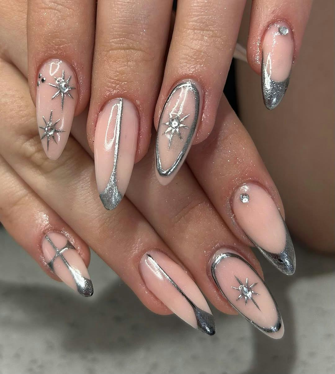 Silver chrome nails are on-trend for winter 2025.