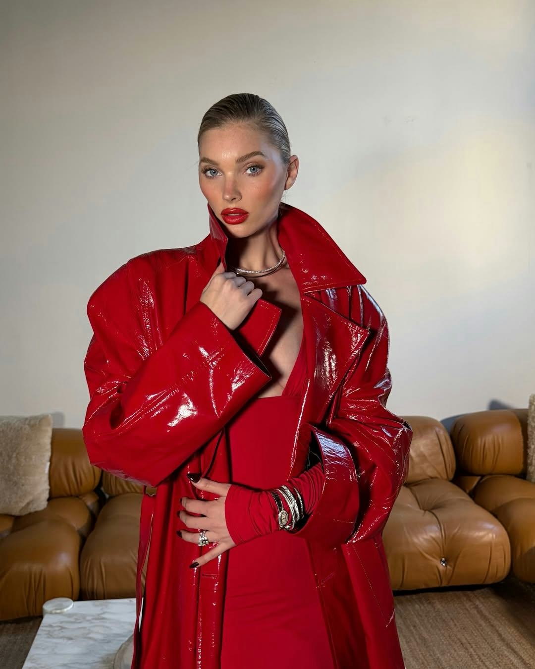 Elsa Hosk wears a red plunging dress.