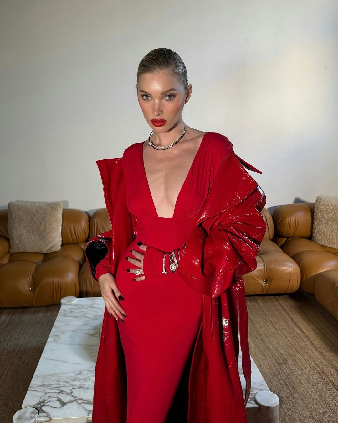 Elsa Hosk wears a red plunging dress.