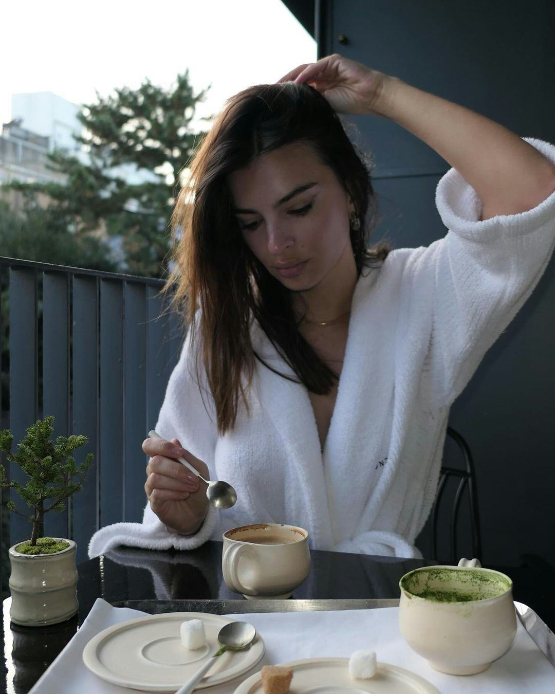 Emily Ratajkowski wears a robe.