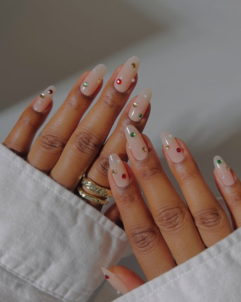 Try minimal nails with colorful rhinestones for New Year’s Eve 2024.