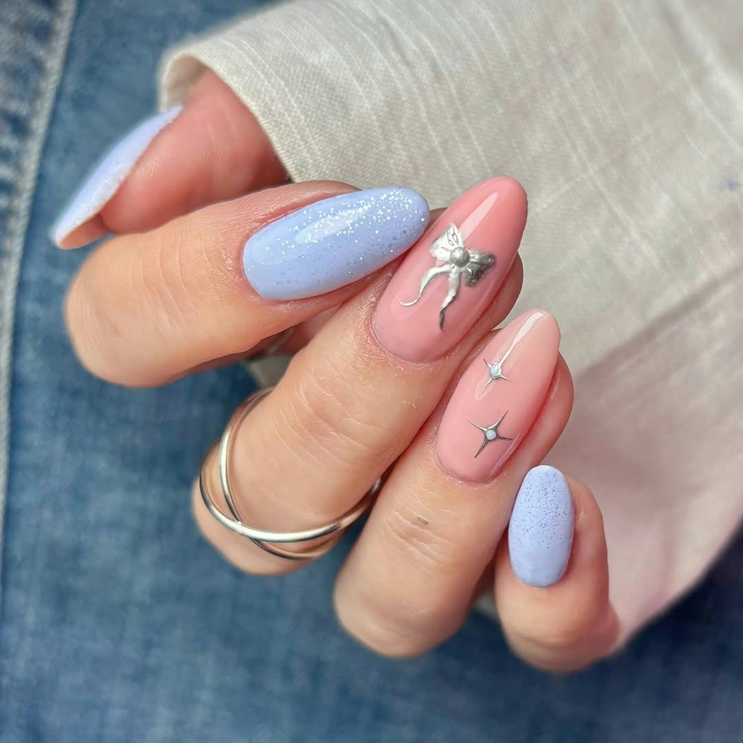 Try baby blue nails with silver ribbon details for New Year&rsquo;s Eve 2024.