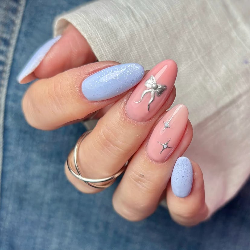 Try baby blue nails with silver ribbon details for New Year’s Eve 2024.