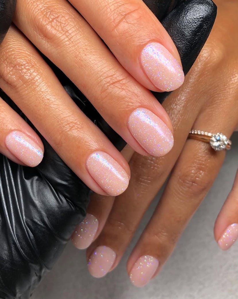 Try mannequin nails with a champagne shimmer for New Year’s Eve 2024.
