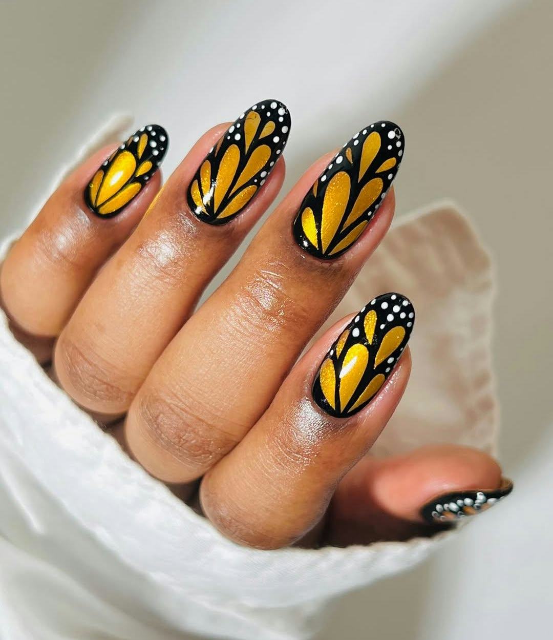 Gold nails fit the &ldquo;goddess energy aesthetic."