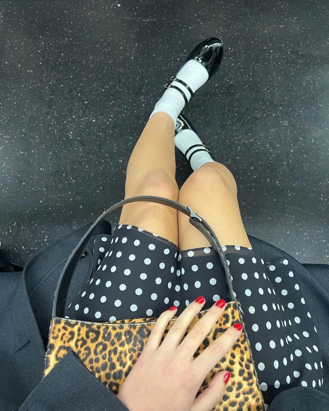 Olivia Rodrigo wears a plunging polka dot dress.