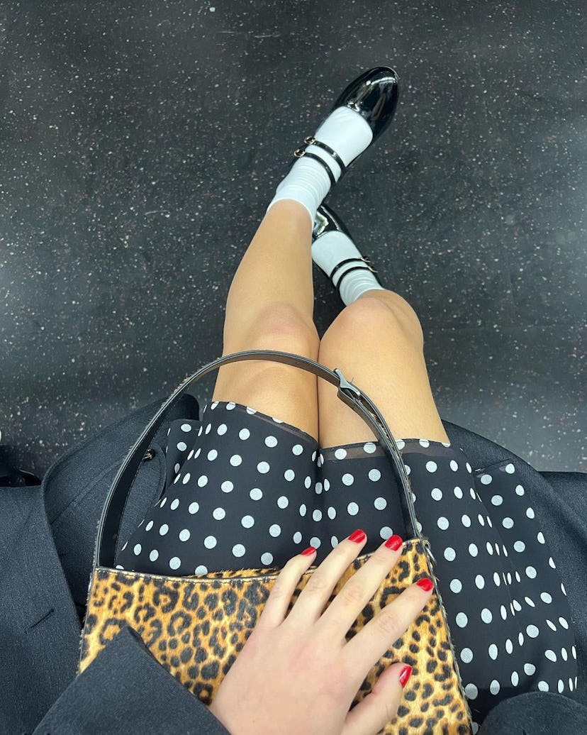 Olivia Rodrigo wears a plunging polka dot dress.