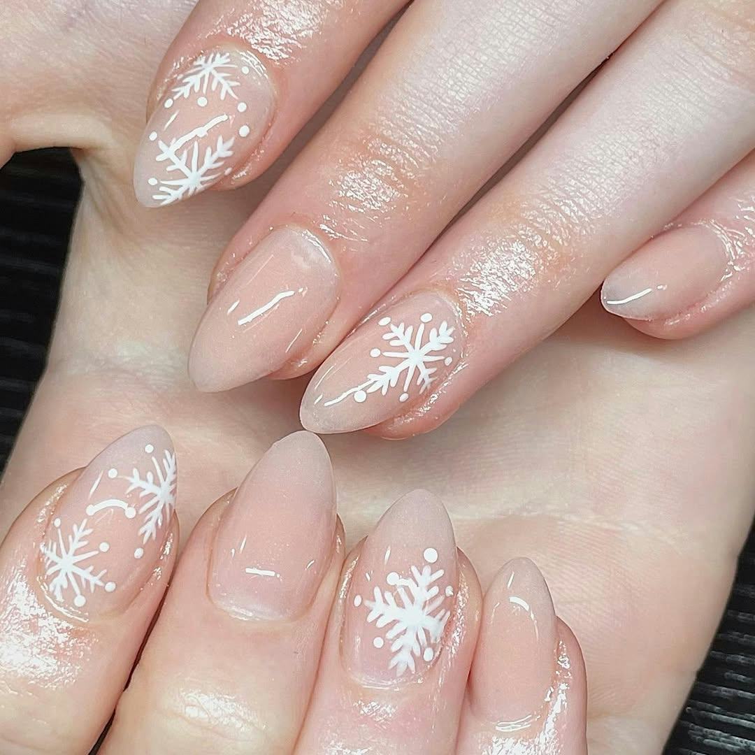 Try neutral nails with snowflake art for Christmas 2024.