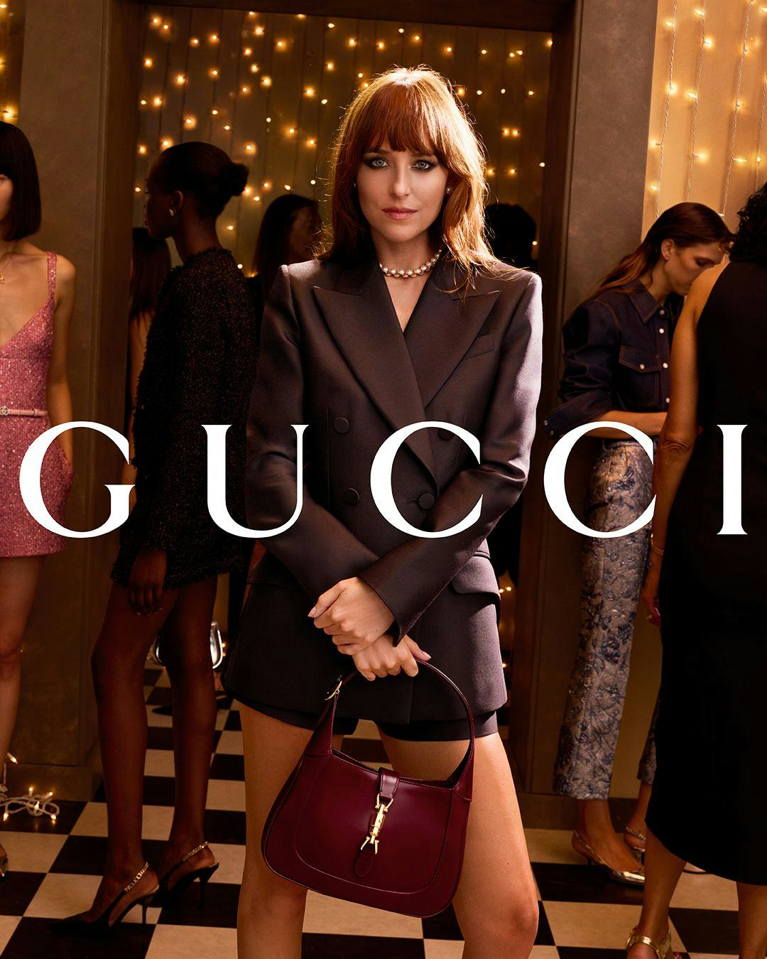 Dakota Johnson stars in the Gucci Gift holiday campaign.