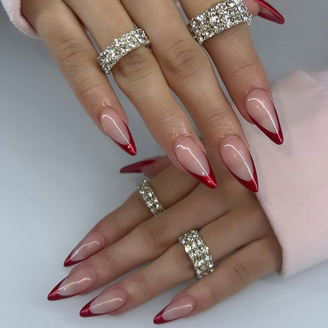 Try red chrome French tip nails for Christmas 2024.