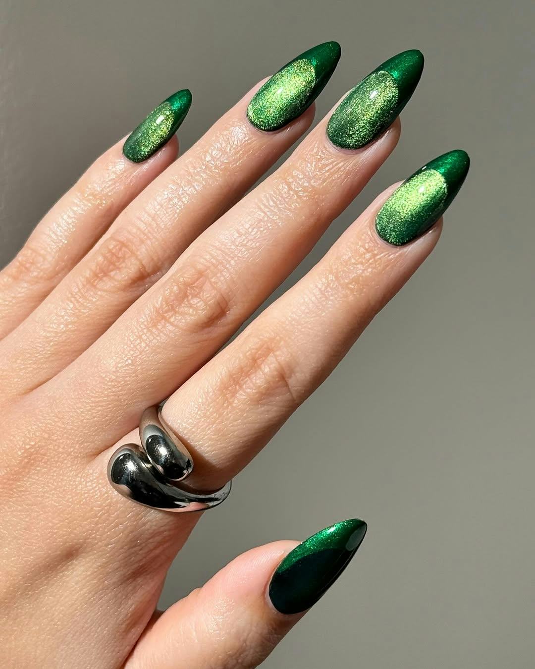 Try monochromatic emerald green nails for Christmas 2024.