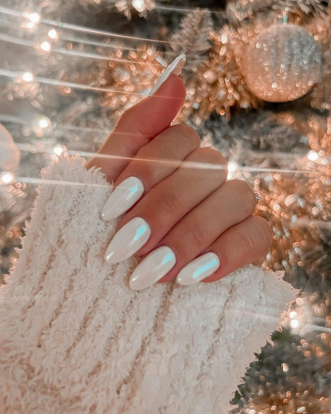 Try white chrome nails for Christmas 2024.