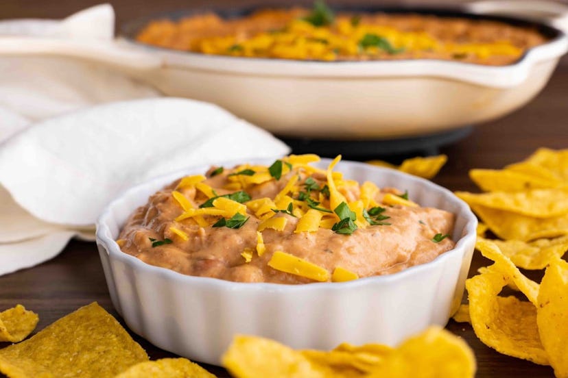 Bean dip with cheese on top, a perfect recipe for super bowl dips.