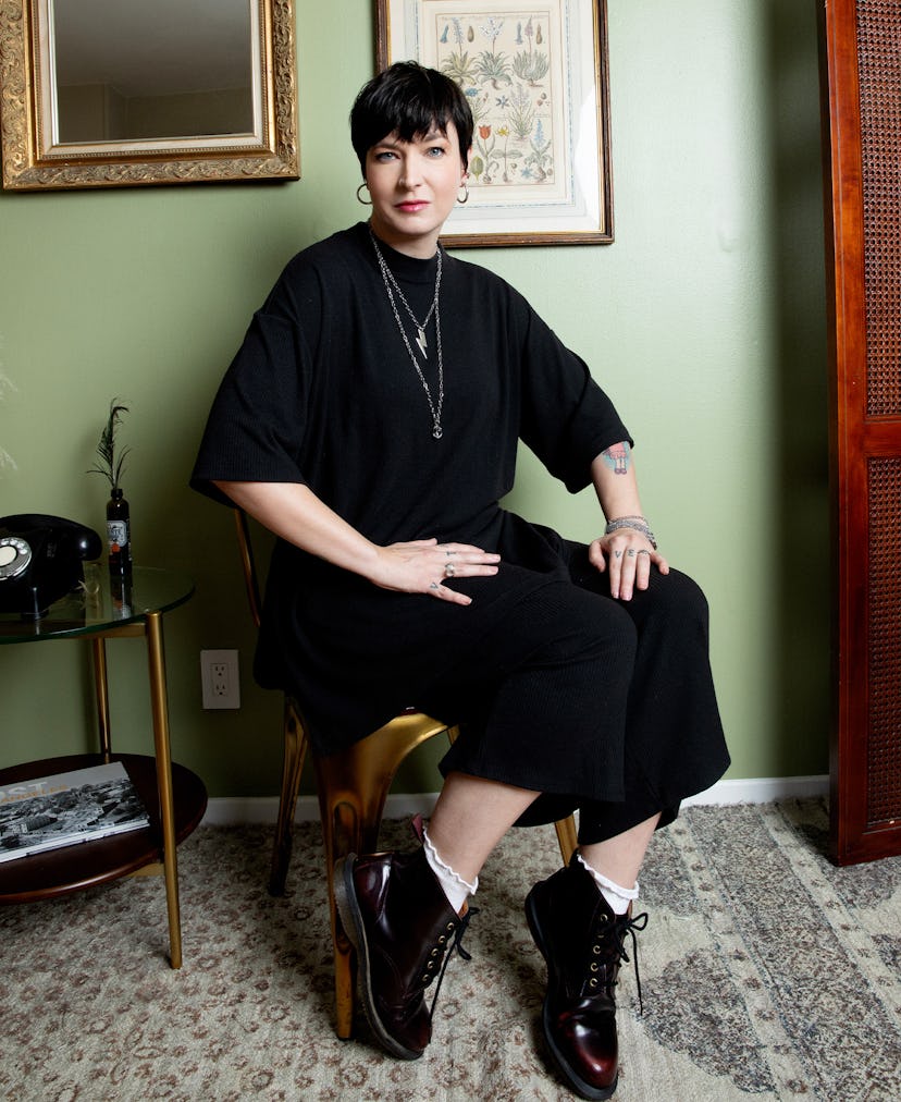 Diablo Cody (aka Brook Maurio) is seated, wearing all black and looking at the camera.