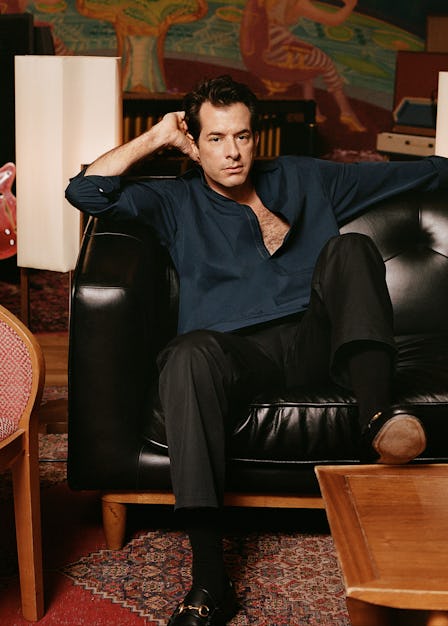 Mark Ronson wears a Gucci top, pants, and shoes; Falke socks; his own watch.