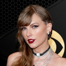 Taylor Swift's Super Bowl 2024 outfit features a saucy corset and rhinestone-studded pants.