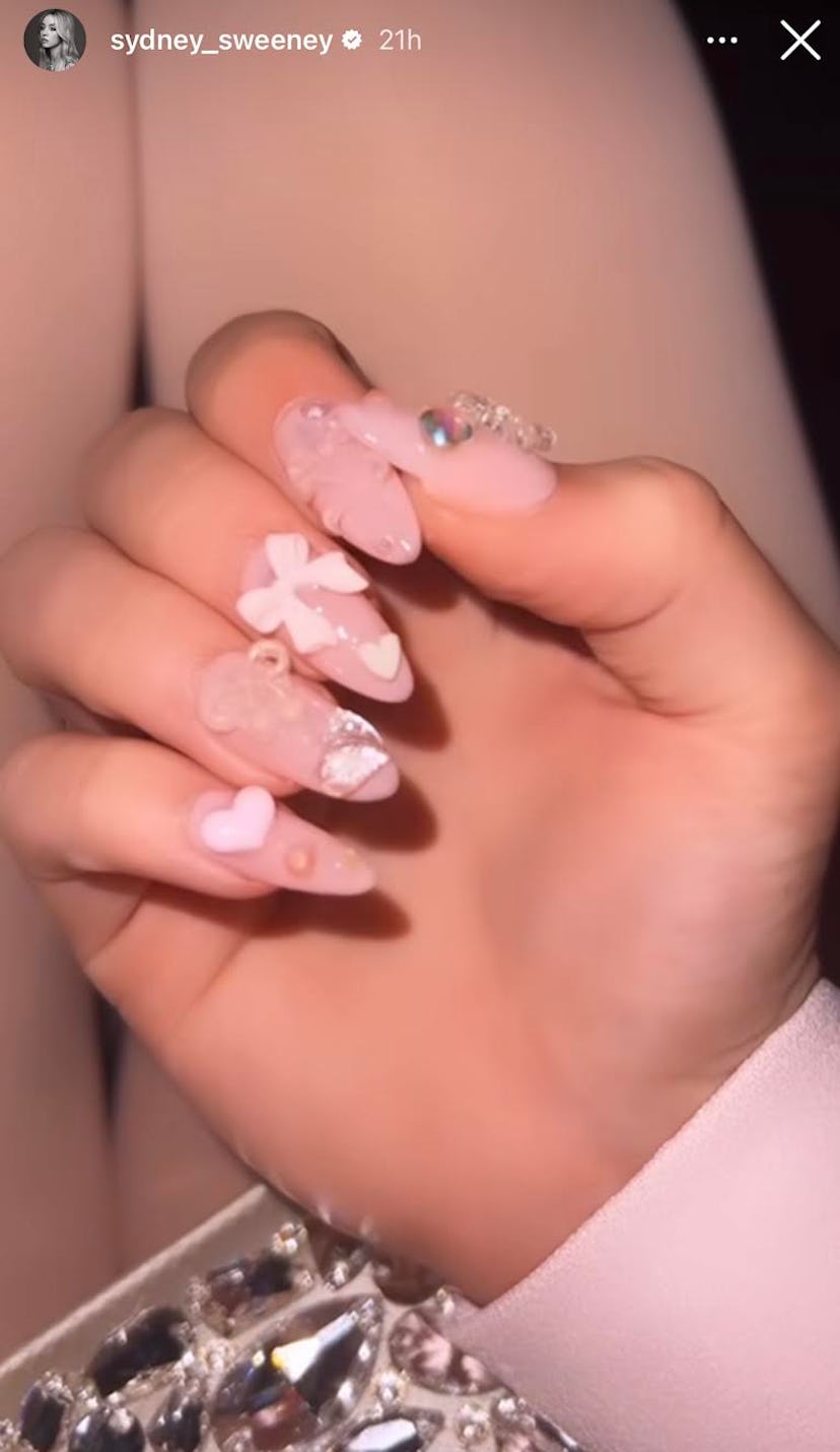 Sydney Sweeney wore “bubble bath” nails with 3D ribbons for Galentine’s Day.