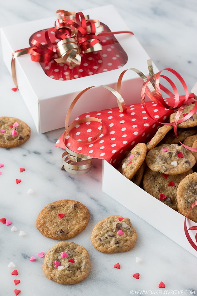 Mini chocolate chip cookies with heart sprinkles, an easy Valentine's Day classroom snack idea.