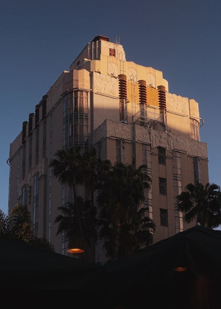 the Sunset Tower Hotel seen from below against a blue sky