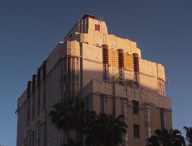 the Sunset Tower Hotel seen from below against a blue sky