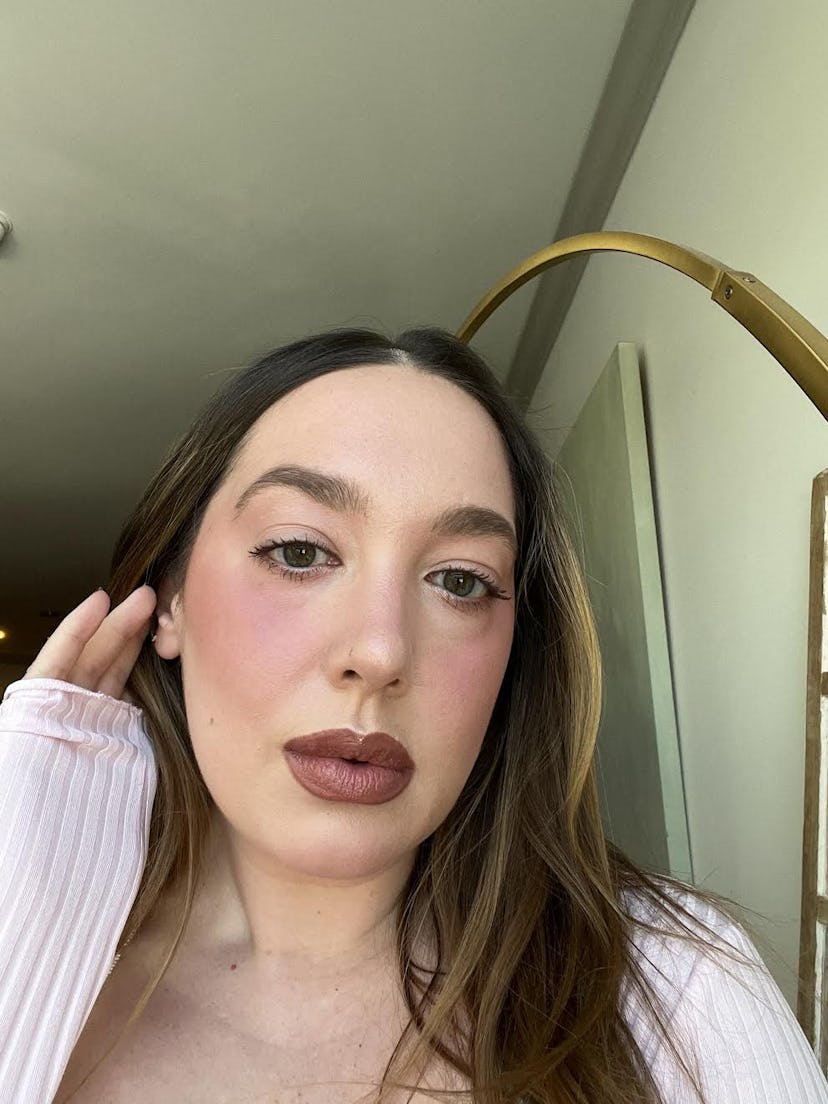 Olivia Rose Rushing wears the r.e.m. beauty Hypernova Satin Matte Blush in Rose On Mars and Pinking …